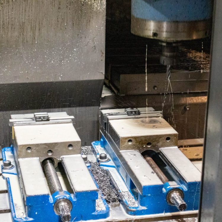 Kurt machine vises mounted on vertical CNC milling machine table